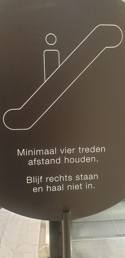 Bijenkorf bord roltrap